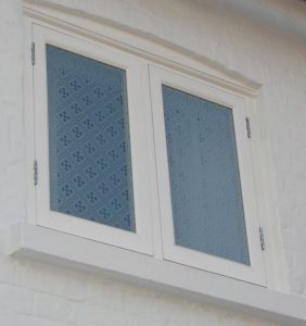 Acid etched patterned glass timber casement window